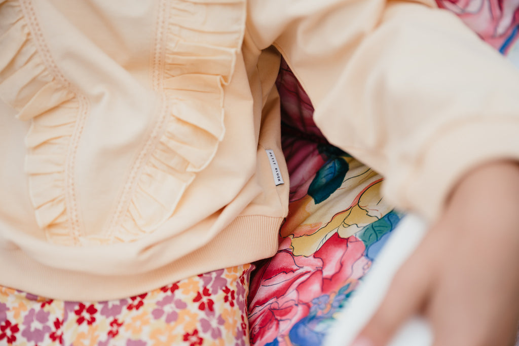 Rüschenpullover | Aprikosensorbet